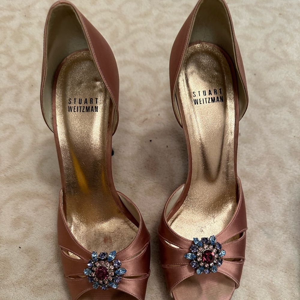 Pink peep toe heel with gem.